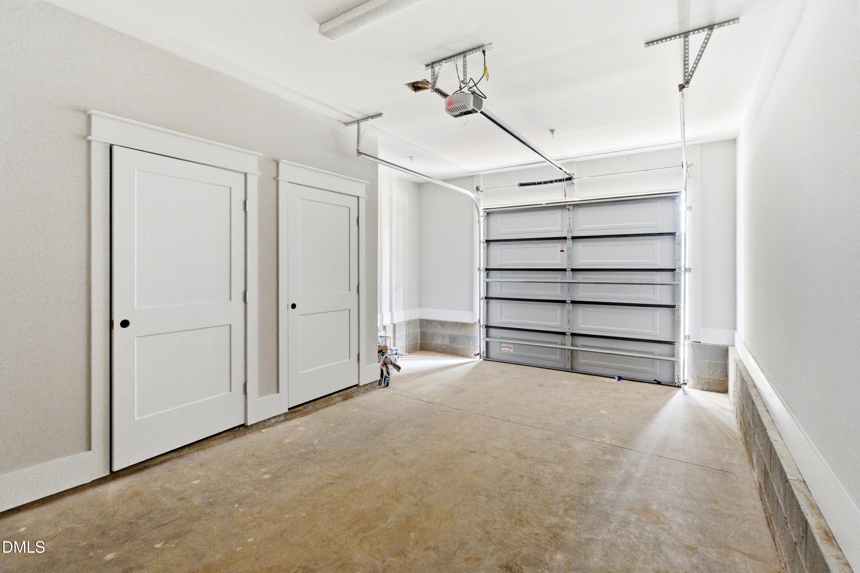 720 Noble Town Way, Unit 106 Raleigh, NC 27603 - Photo 23 of 28 a view of room that has a bed and a cabinets