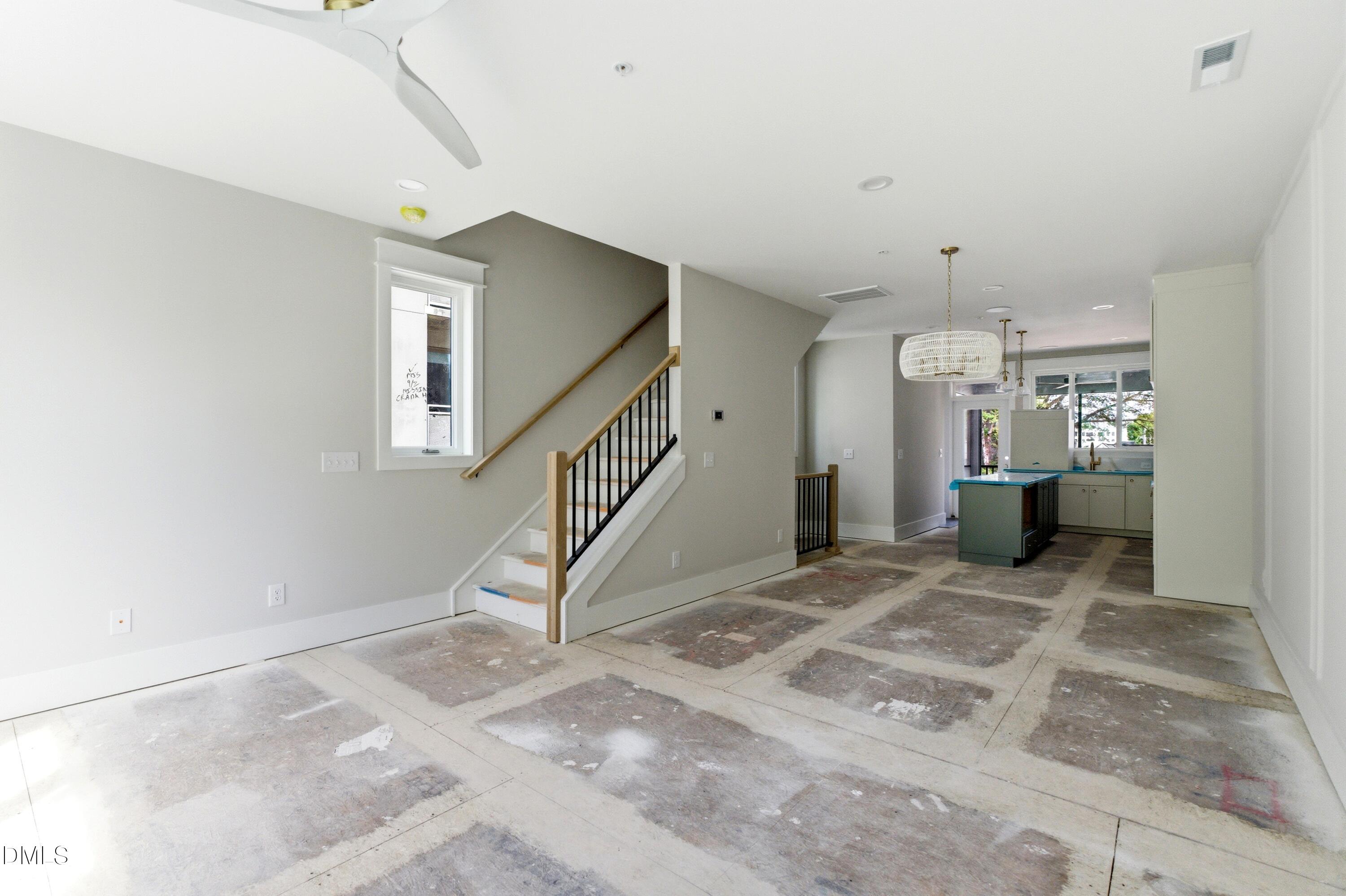720 Noble Town Way, Unit 106 Raleigh, NC 27603 - Photo 7 of 28 a view of a hallway with staircase