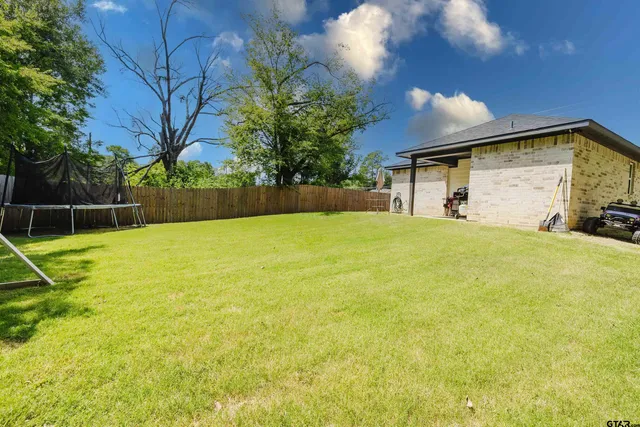 a swimming pool with wooden fence