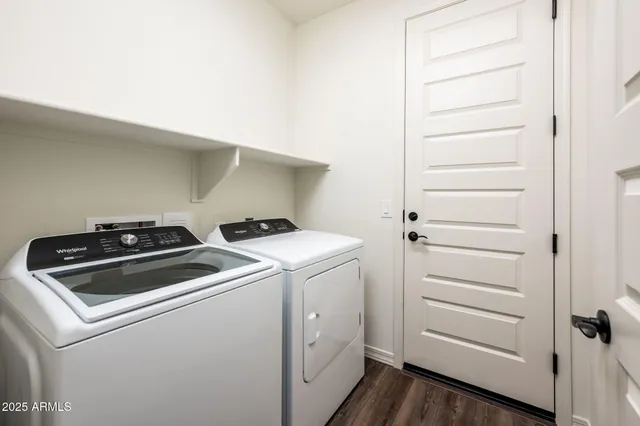 a view of storage and utility room with washer and dryer