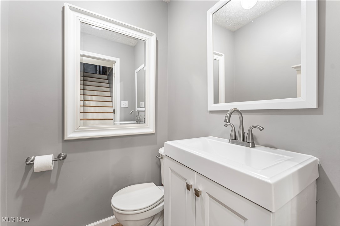 155 Ridgewood Boulevard Belpre, OH 45714 - Photo 16 of 49 Bathroom featuring vanity and a textured ceiling
