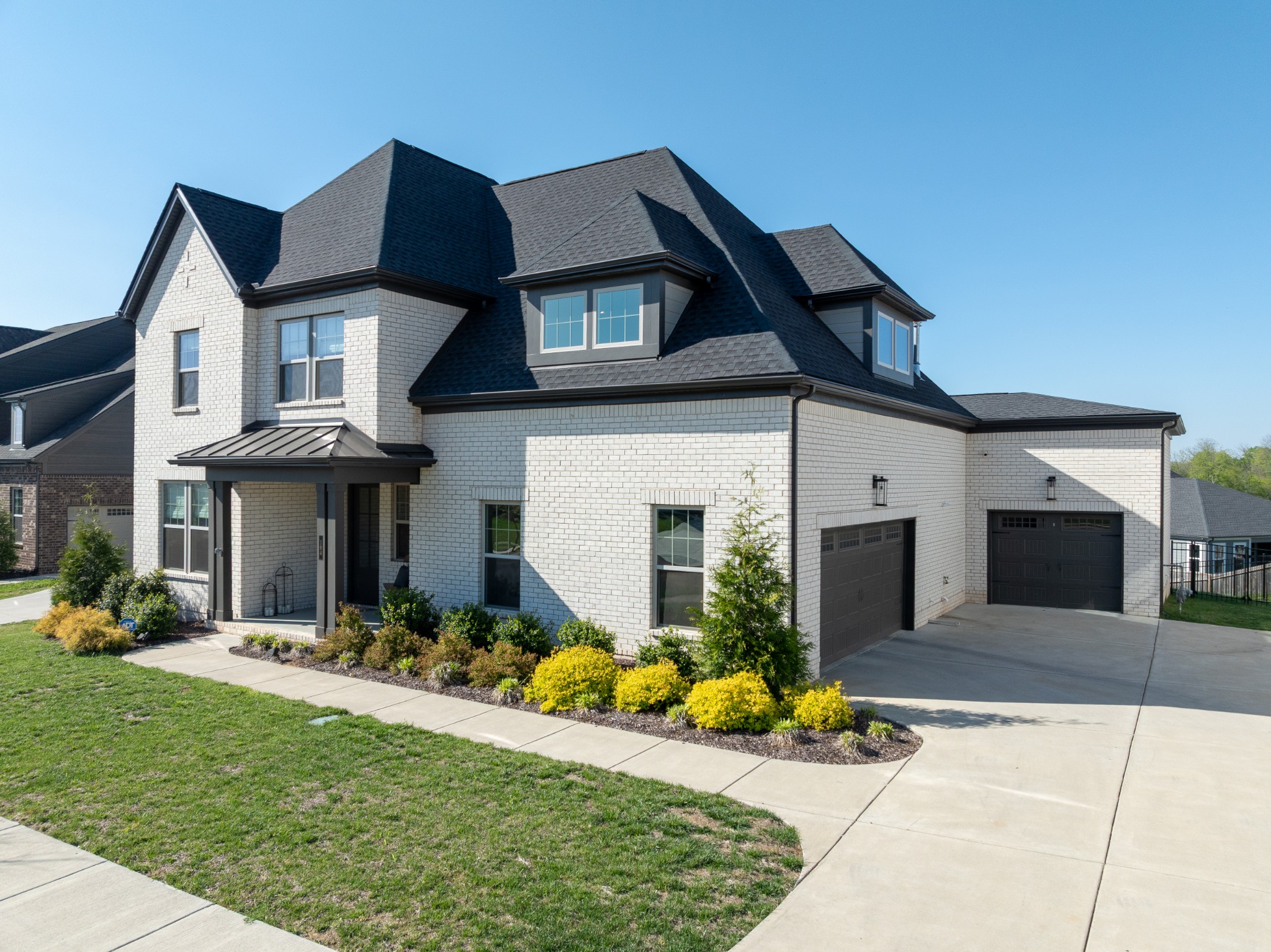 194 Phillips Bend Spring Hill Spring Hill, TN 37174 - Photo 2 of 70 a front view of a house with a porch and furniture