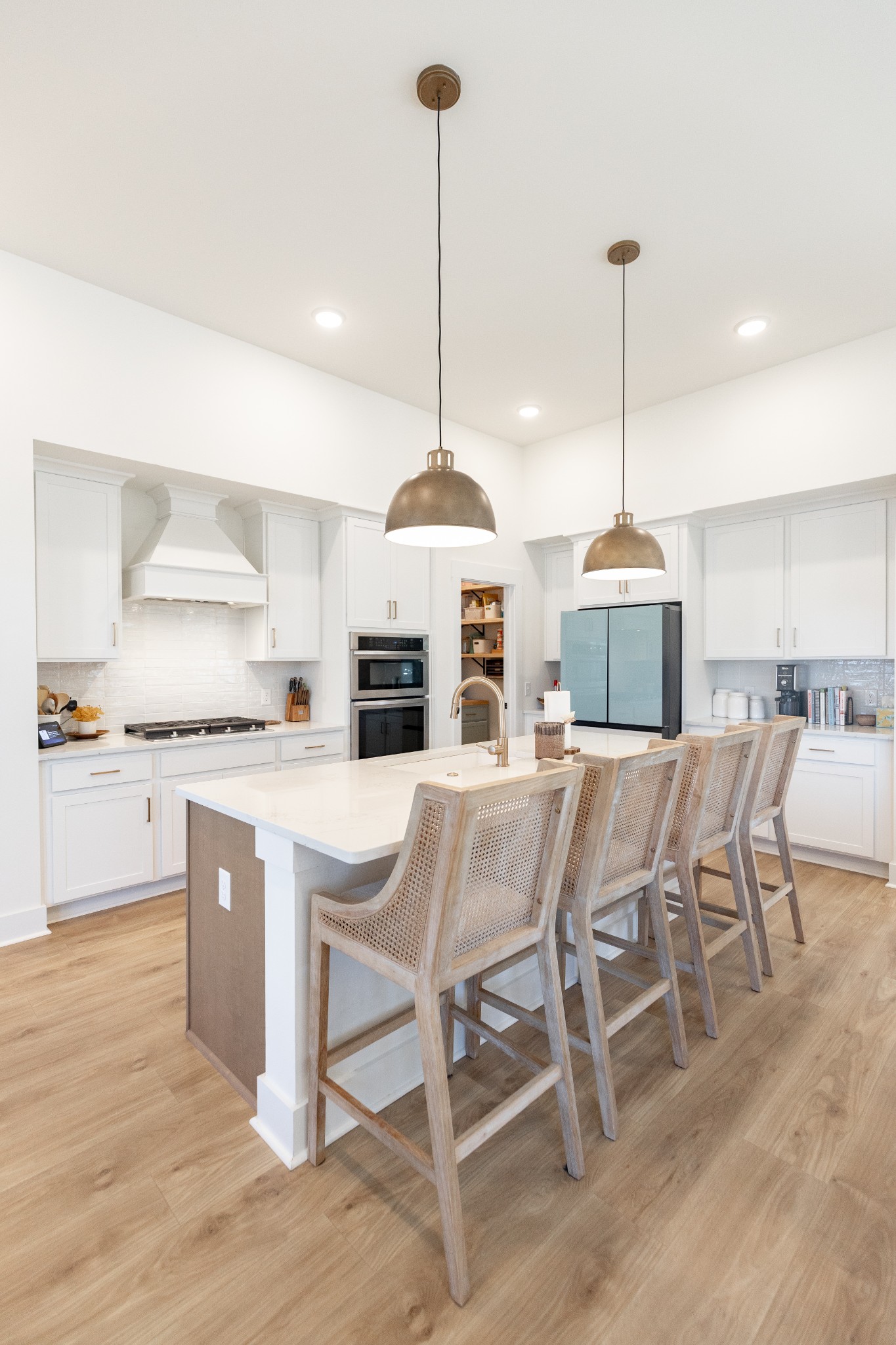 194 Phillips Bend Spring Hill Spring Hill, TN 37174 - Photo 28 of 70 a kitchen with stainless steel appliances kitchen island granite countertop a stove a sink island and a wooden floor