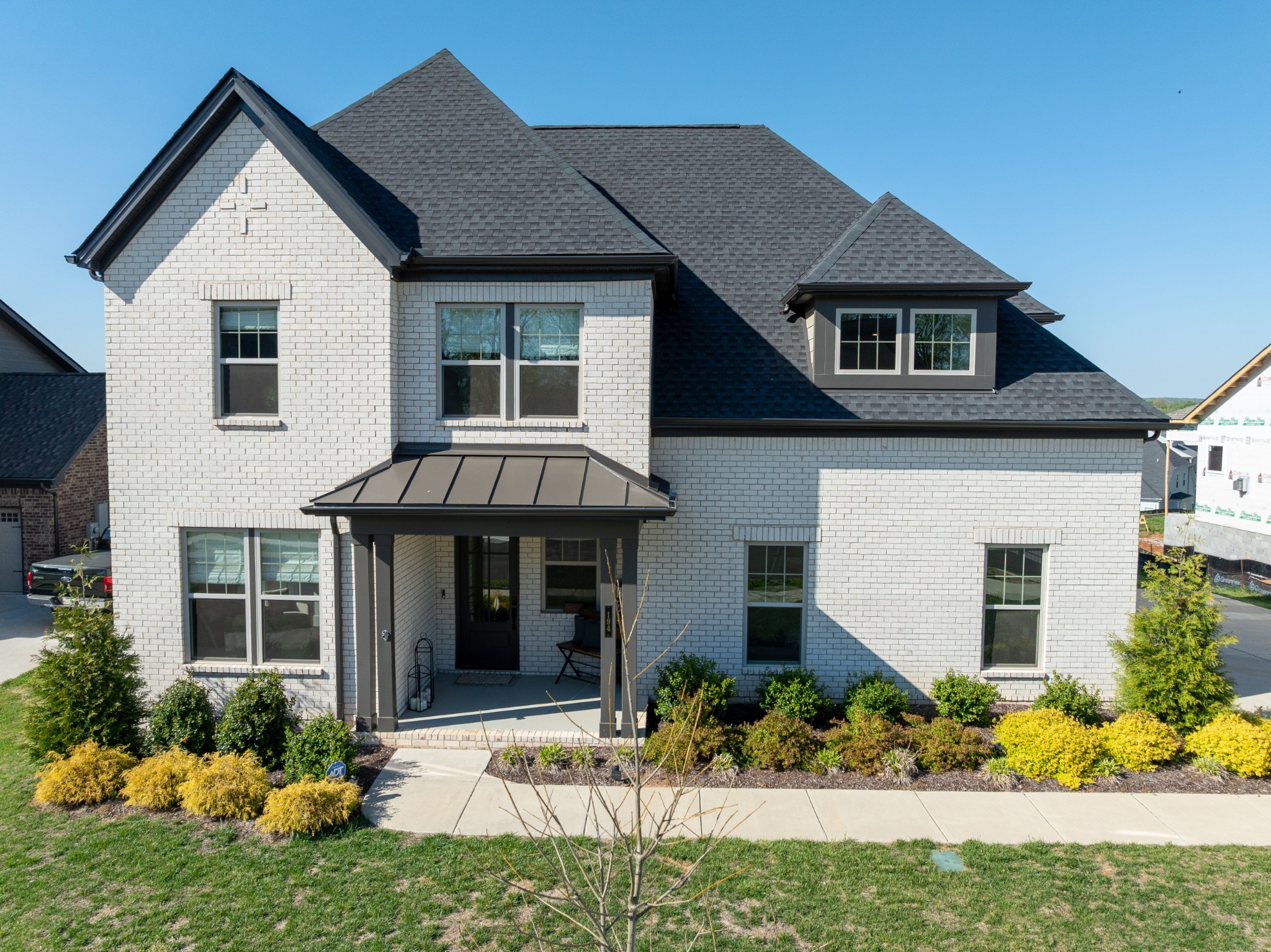 194 Phillips Bend Spring Hill Spring Hill, TN 37174 - Photo 3 of 70 a front view of a house with a yard and outdoor seating