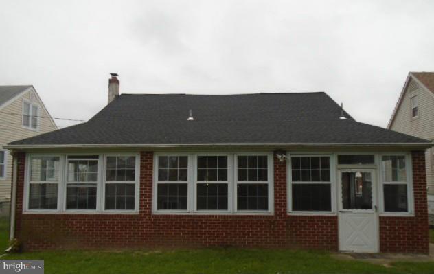 3210 Lynch Road Baltimore, MD 21219 - Photo 14 of 15 a front view of a house with a garden