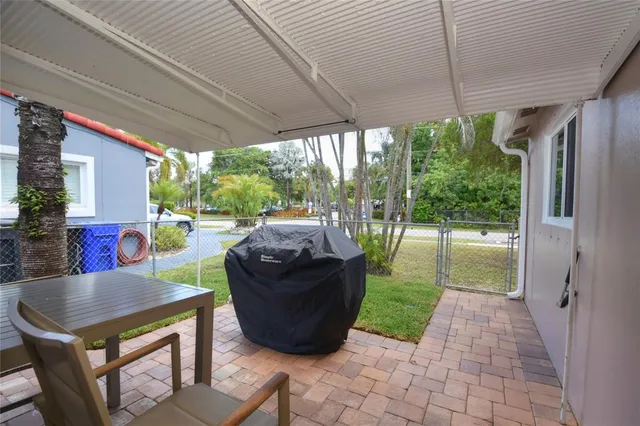 a view of a patio in the backyard