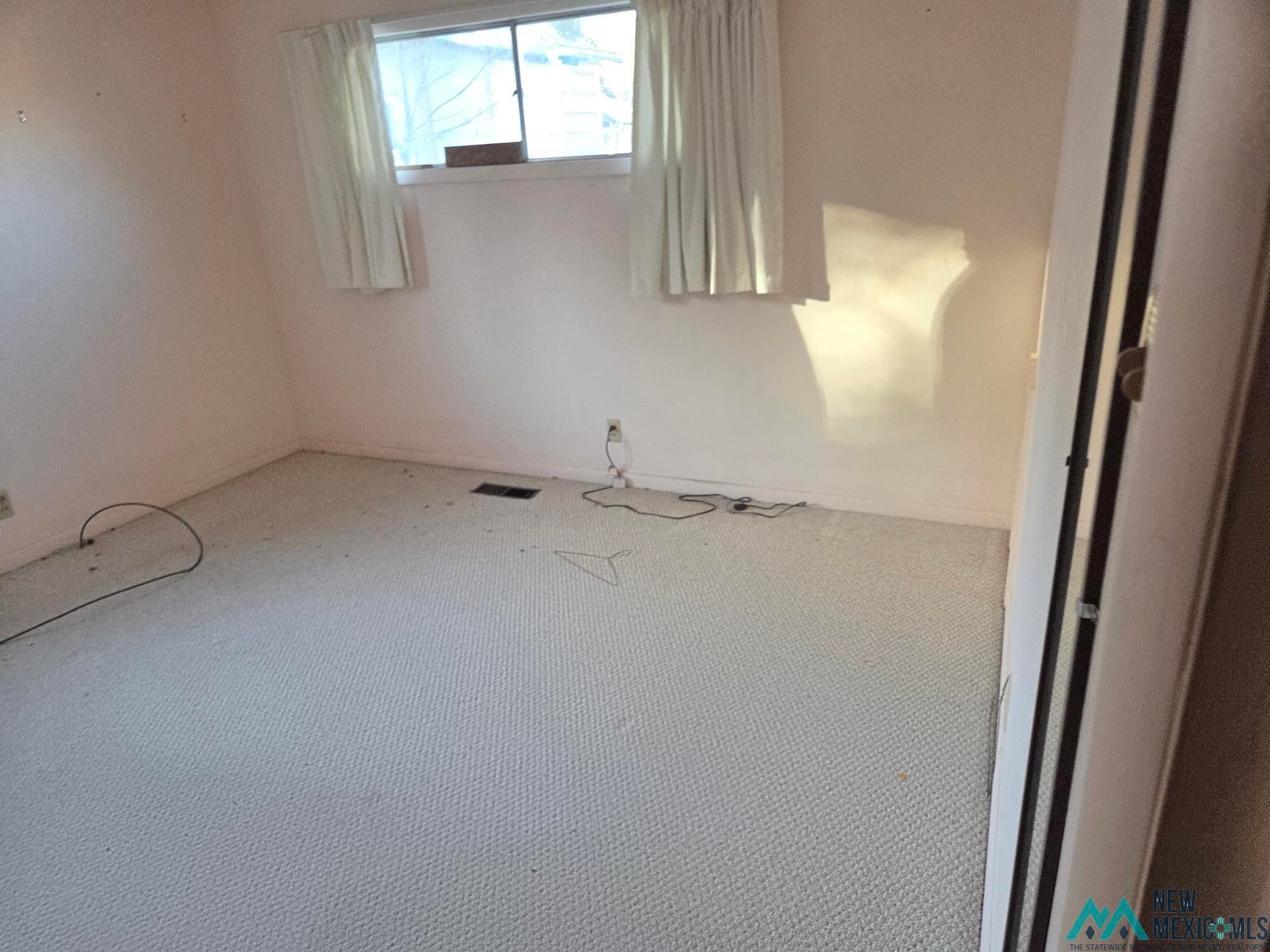 1522 Hogan Street Raton, NM 87740 - Photo 10 of 13 View of carpeted spare room