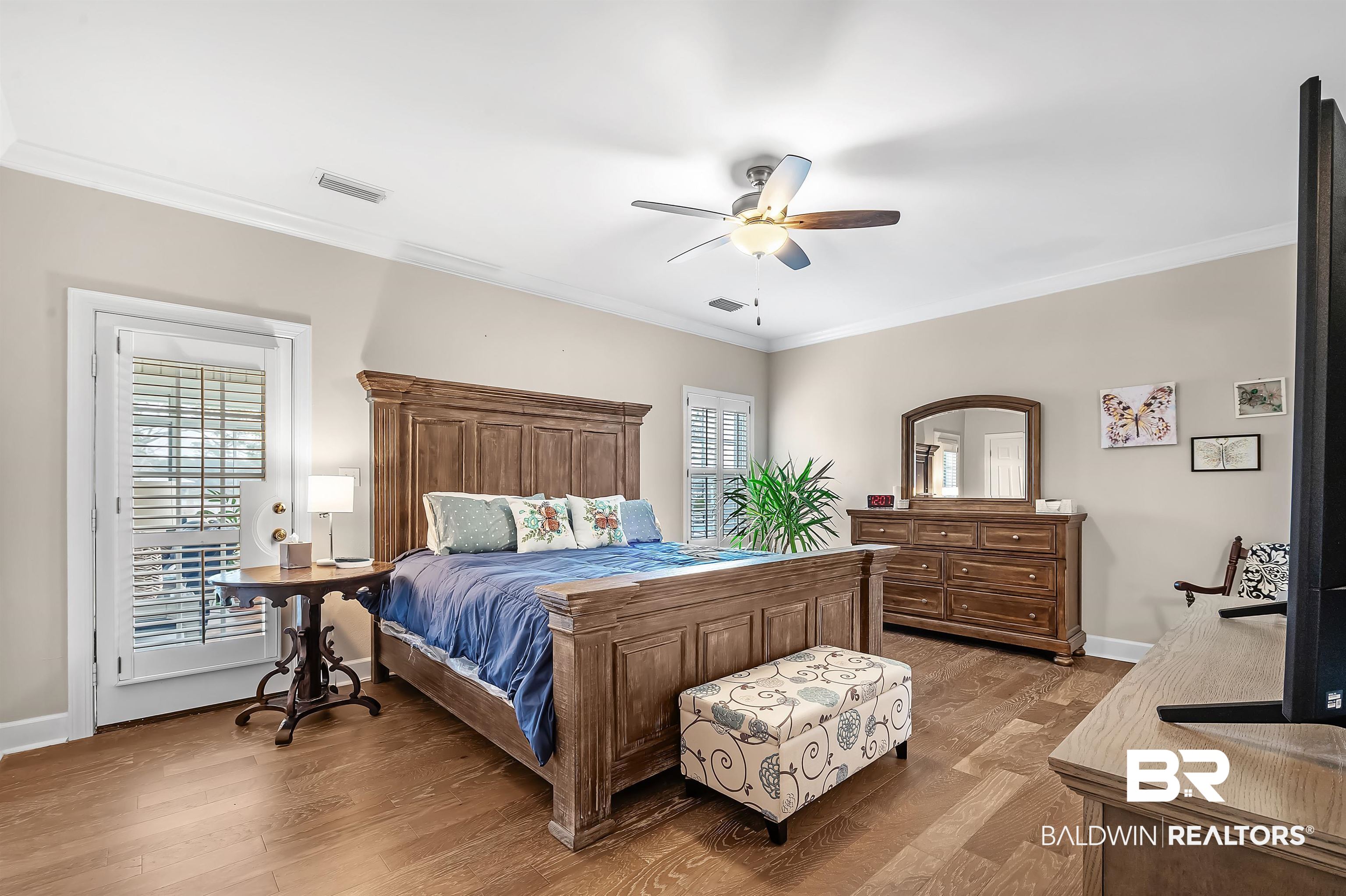 8915 Bay Point Drive Elberta, AL 36530 - Photo 49 of 74 Bedroom with light wood-type flooring, crown molding, and baseboards