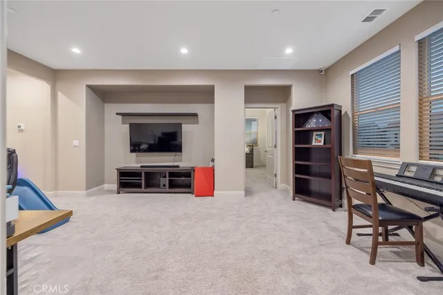a view of workspace with furniture and cabinet