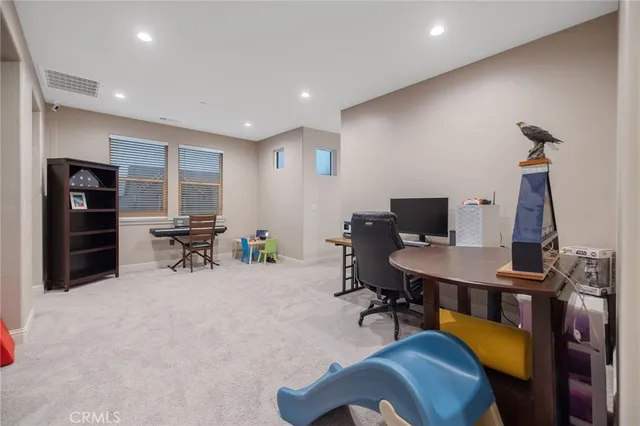 a view of a workspace with furniture