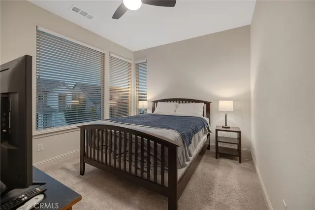 a bedroom with a bed and window