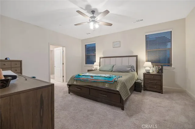 a bed room with a bed and a night stand