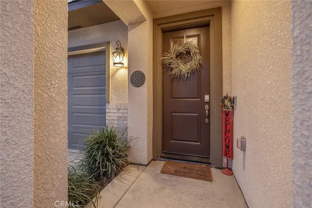 a view of a front door and wooden door
