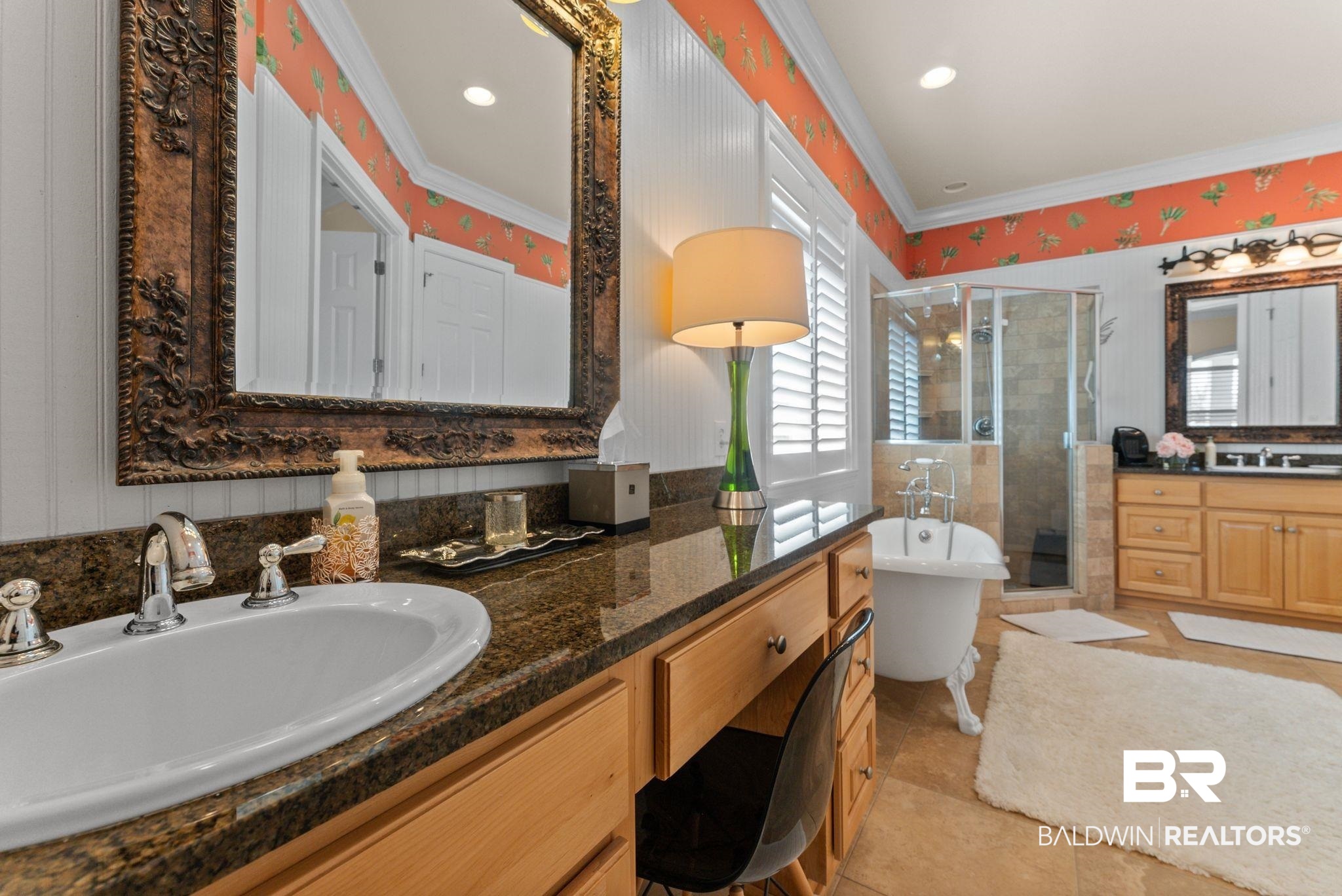 30818 River Road Orange Beach, AL 36561 - Photo 42 of 81 Bathroom featuring a stall shower, two vanities, a freestanding tub, ornamental molding, and light tile patterned floors