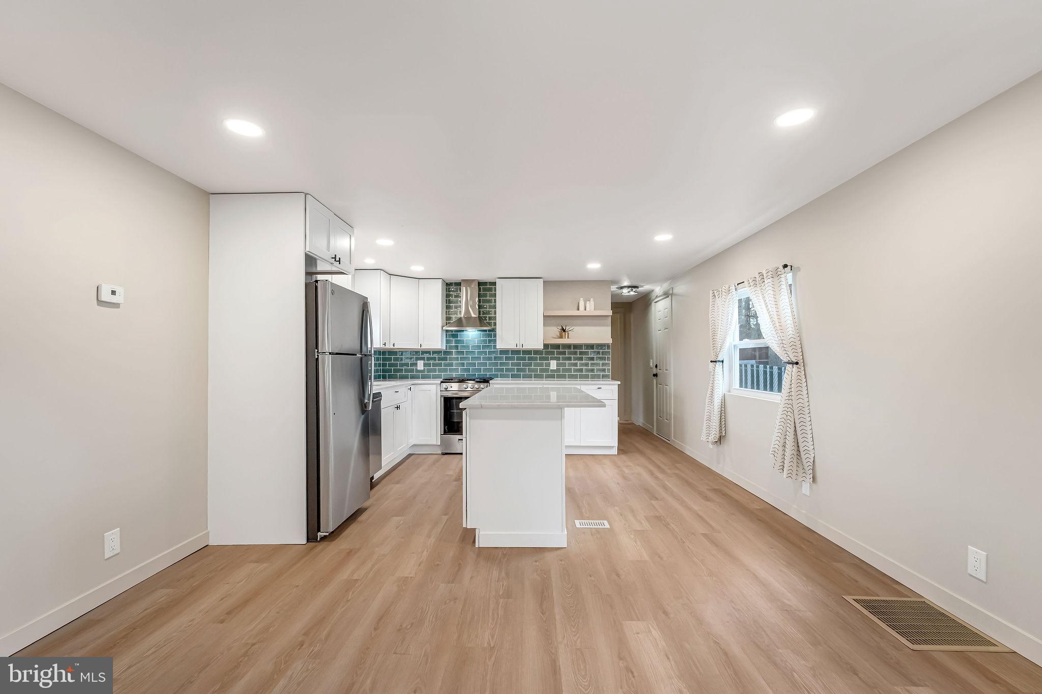 3620 Weymouth Road Browns Mills, NJ 08015 - Photo 12 of 27 a kitchen with a refrigerator and a sink
