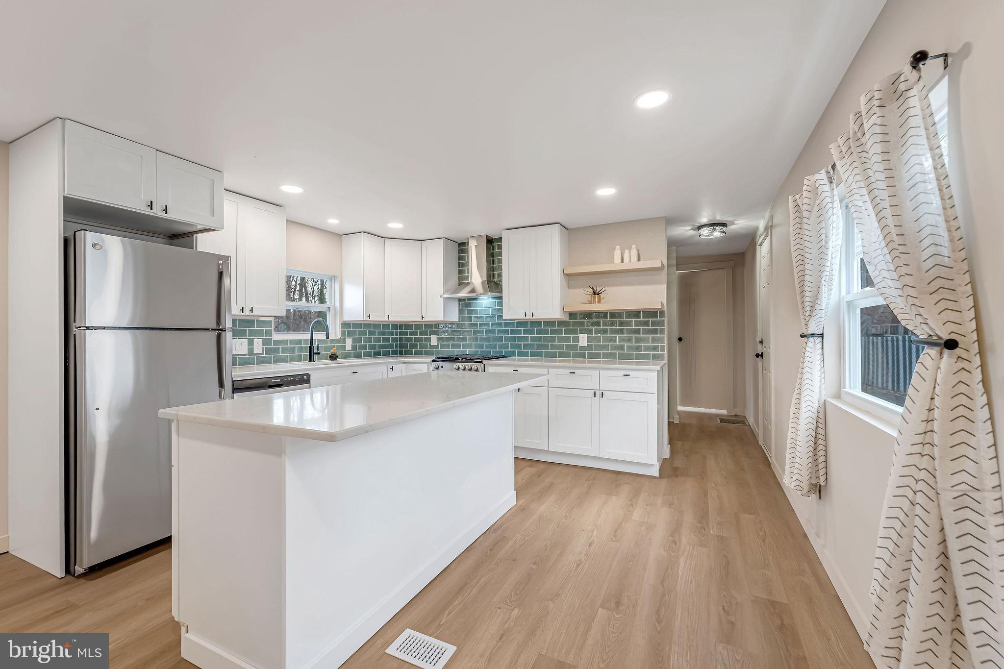 3620 Weymouth Road Browns Mills, NJ 08015 - Photo 13 of 27 a kitchen with stainless steel appliances granite countertop a refrigerator a sink and a stove