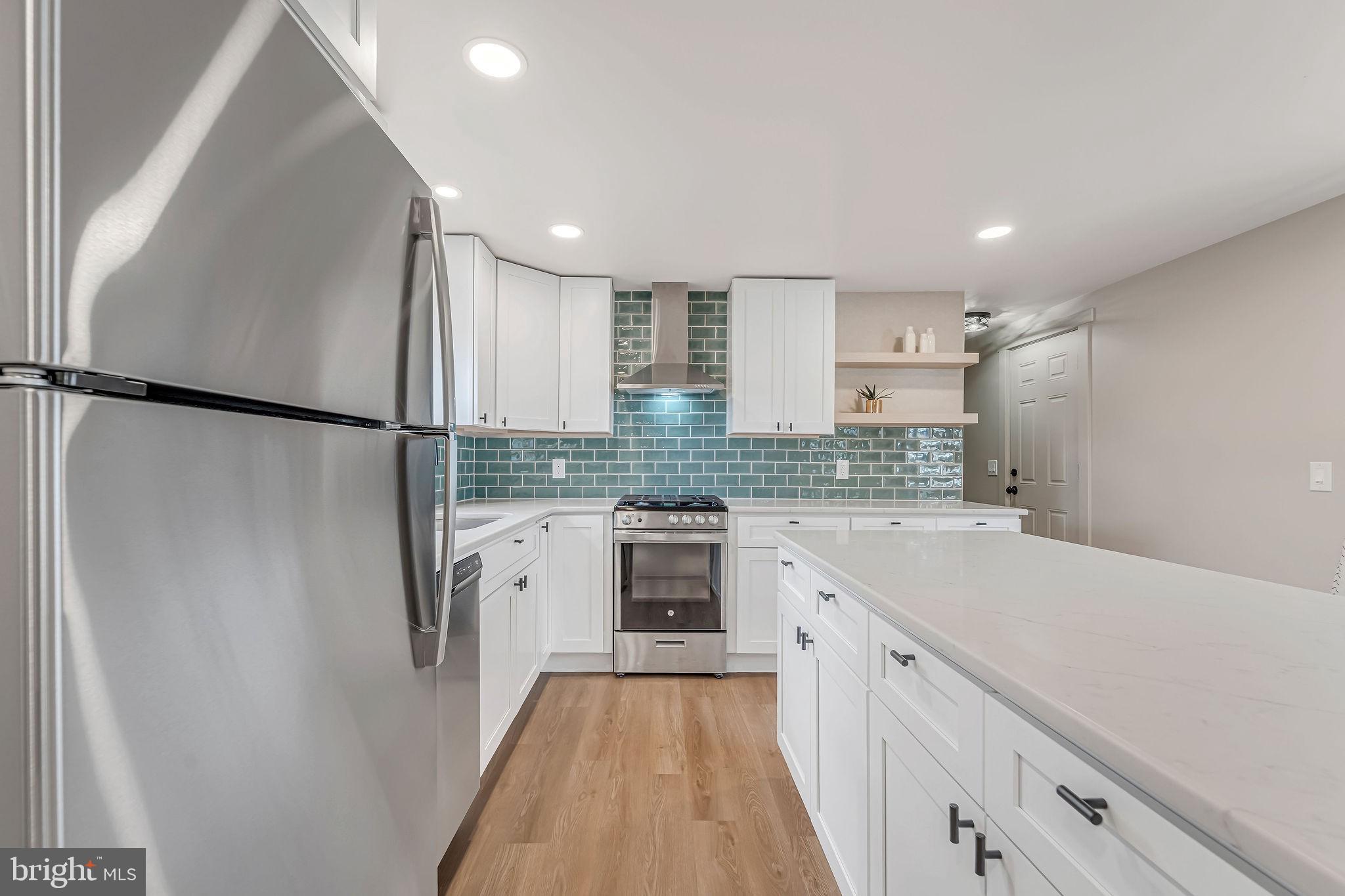 3620 Weymouth Road Browns Mills, NJ 08015 - Photo 14 of 27 a kitchen with a refrigerator a sink and cabinets