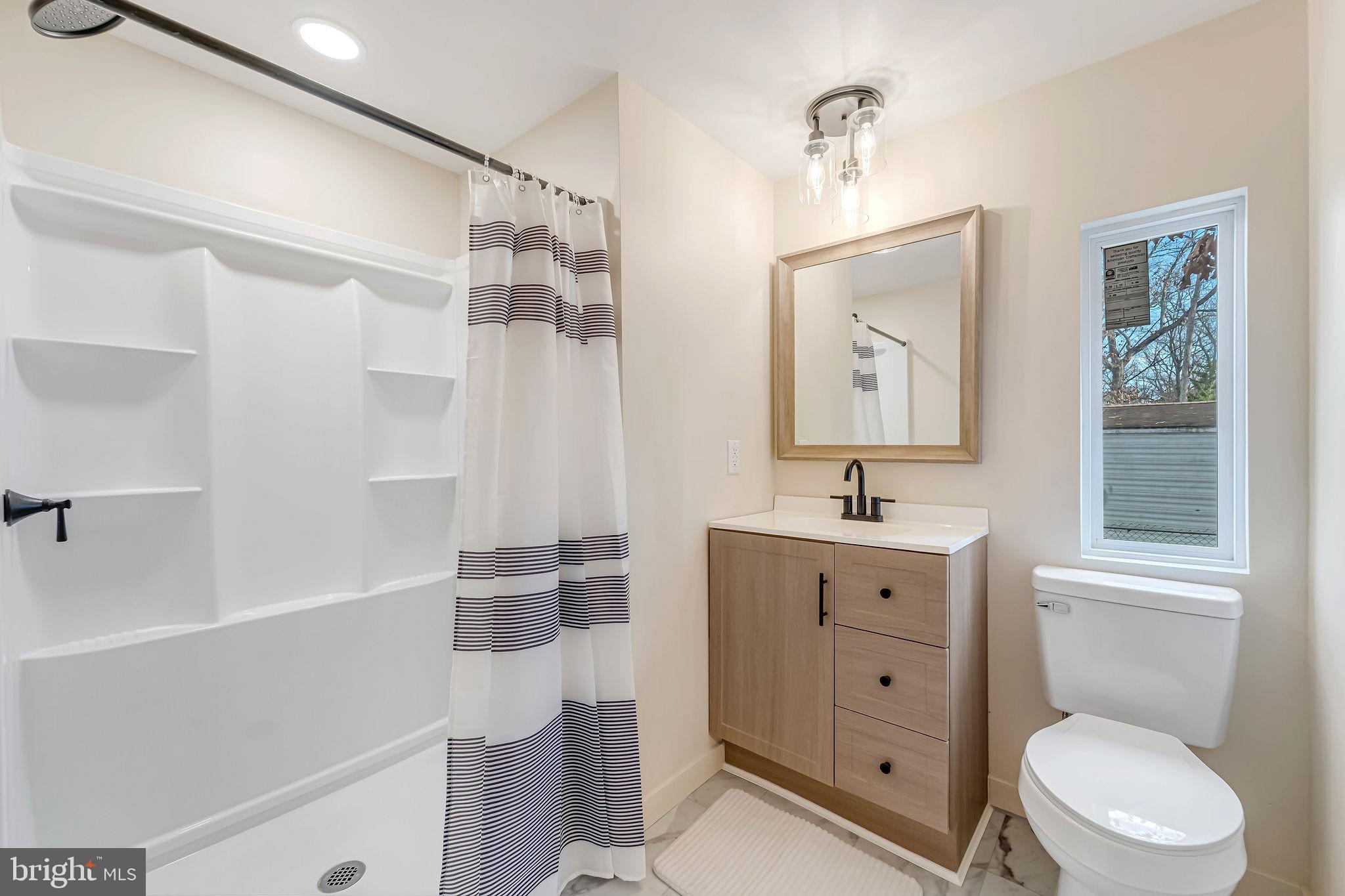 3620 Weymouth Road Browns Mills, NJ 08015 - Photo 19 of 27 a bathroom with a sink a toilet and shower