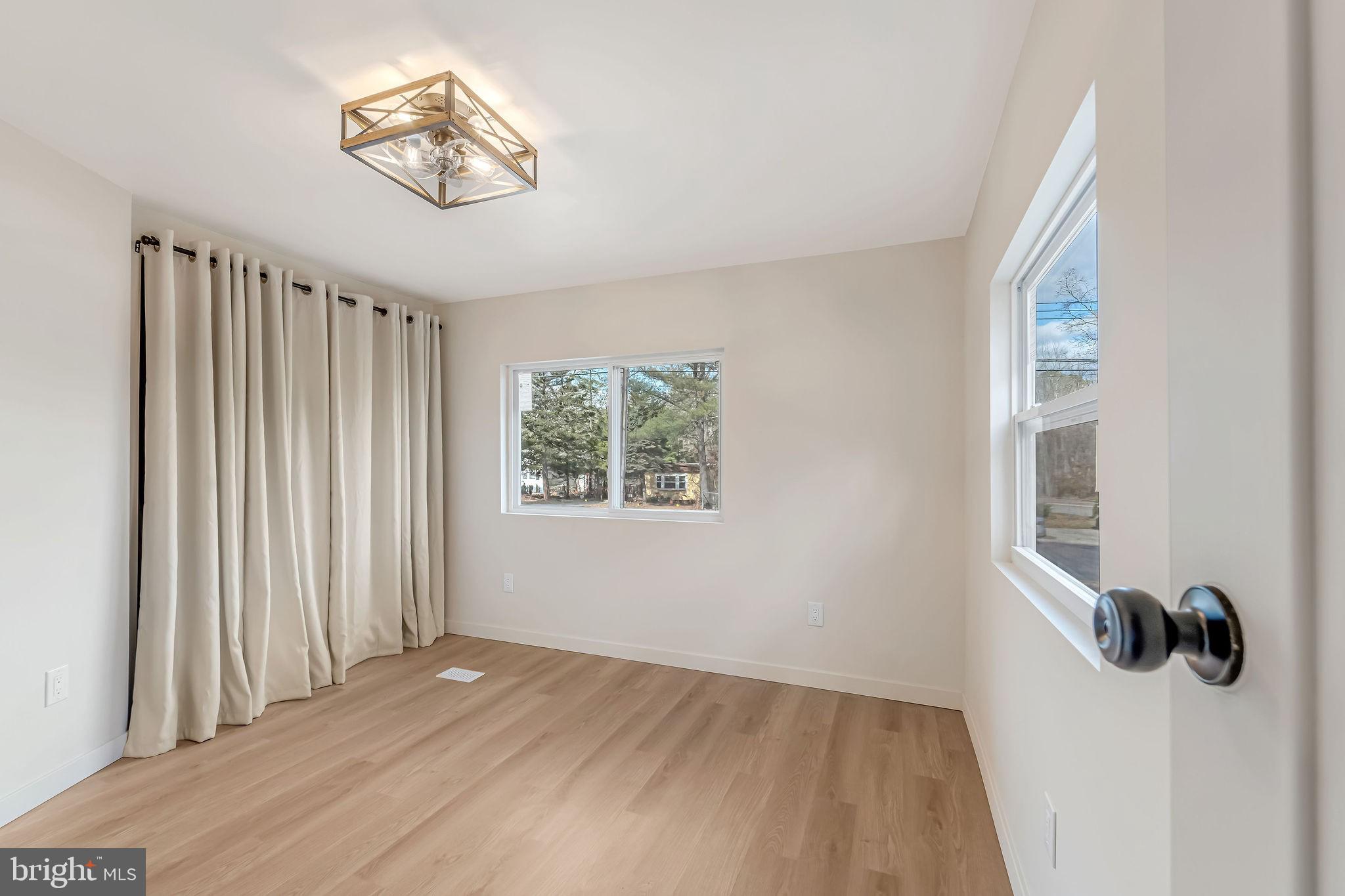 3620 Weymouth Road Browns Mills, NJ 08015 - Photo 23 of 27 wooden floor in an empty room with a window