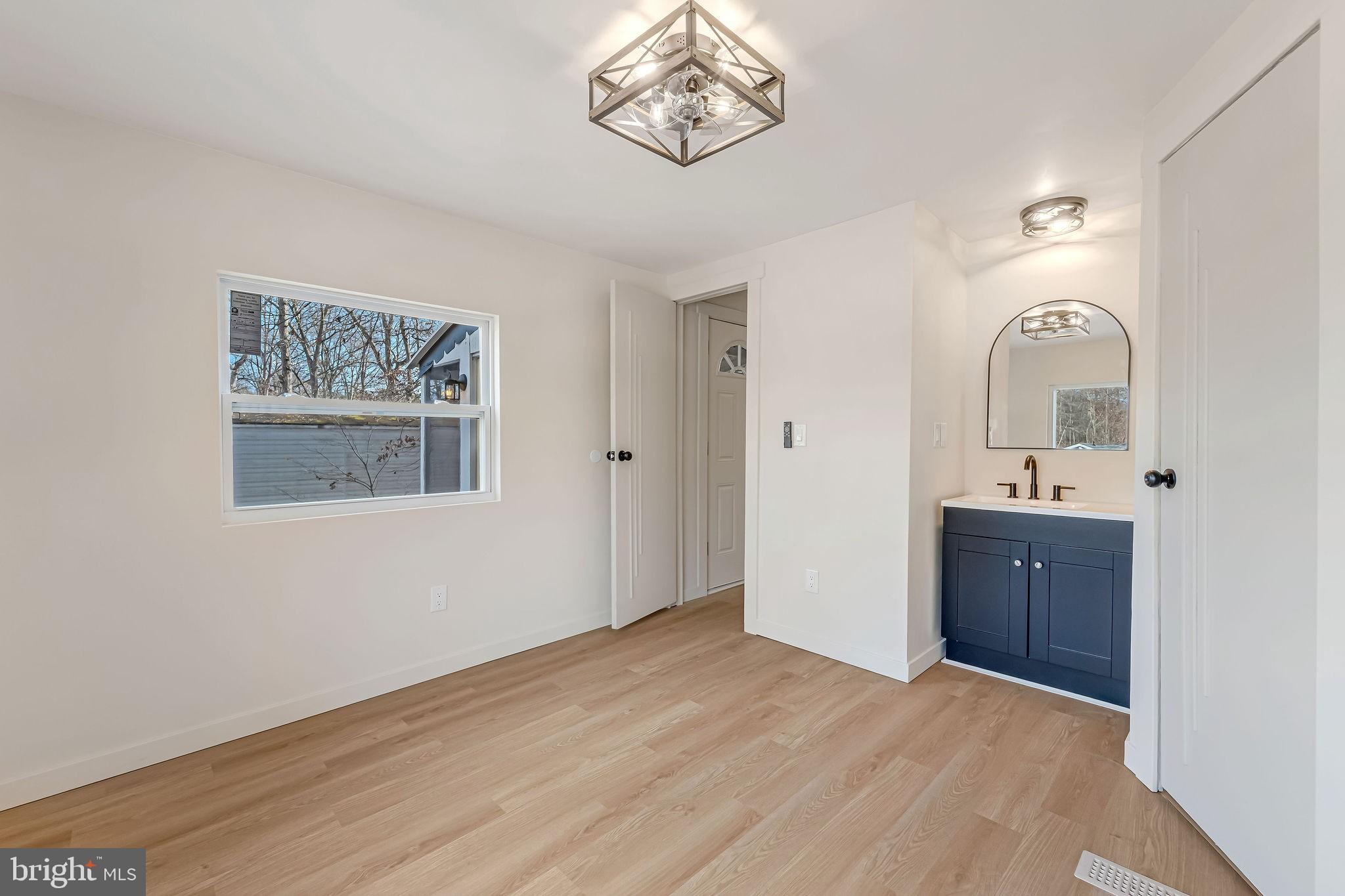 3620 Weymouth Road Browns Mills, NJ 08015 - Photo 25 of 27 a view of an empty room with window and wooden floor