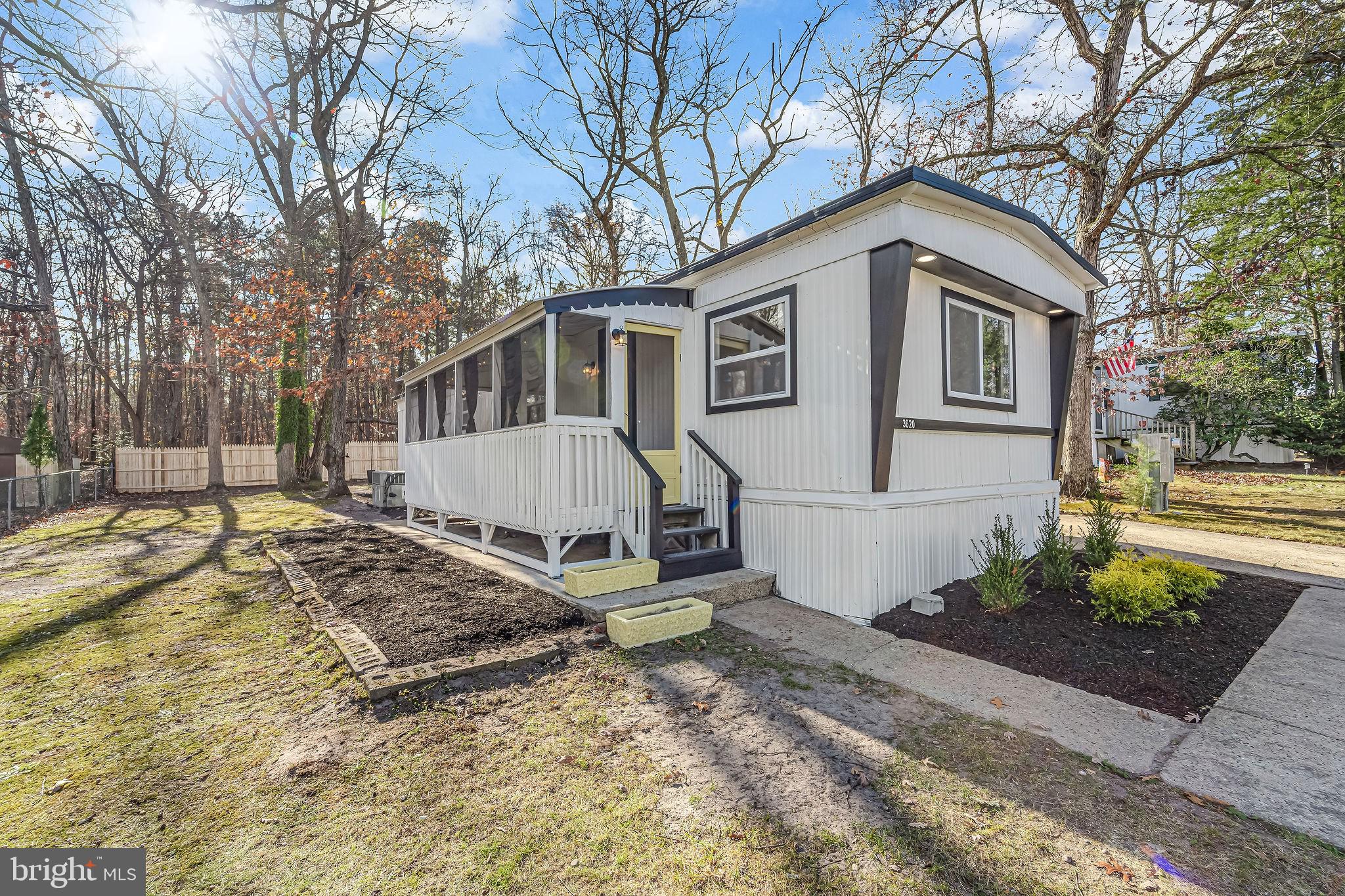 3620 Weymouth Road Browns Mills, NJ 08015 - Photo 4 of 27 a view of a white house with a large tree in front of it