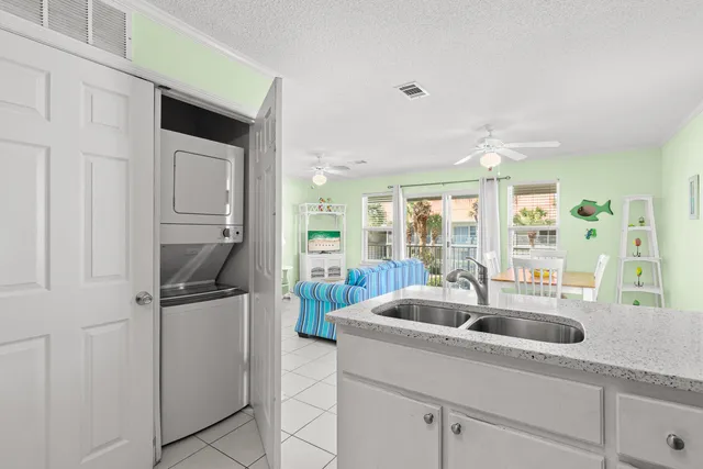 a kitchen with a sink and refrigerator