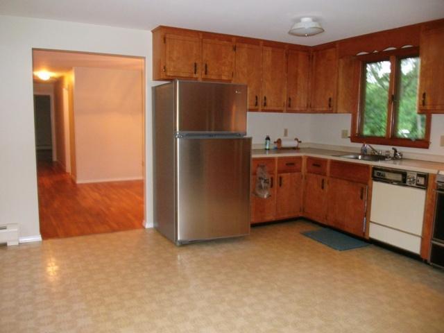 23 Ansel Howland Road Centerville, MA 02632 - Photo 14 of 27 a kitchen with stainless steel appliances granite countertop a refrigerator a sink and a stove