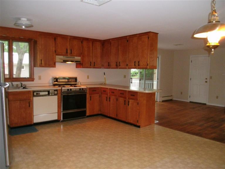 23 Ansel Howland Road Centerville, MA 02632 - Photo 15 of 27 a kitchen with stainless steel appliances granite countertop a stove a sink dishwasher and a refrigerator