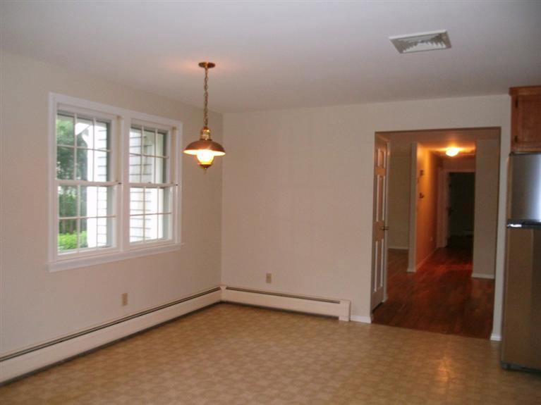 23 Ansel Howland Road Centerville, MA 02632 - Photo 17 of 27 a view of an empty room with glass door and windows