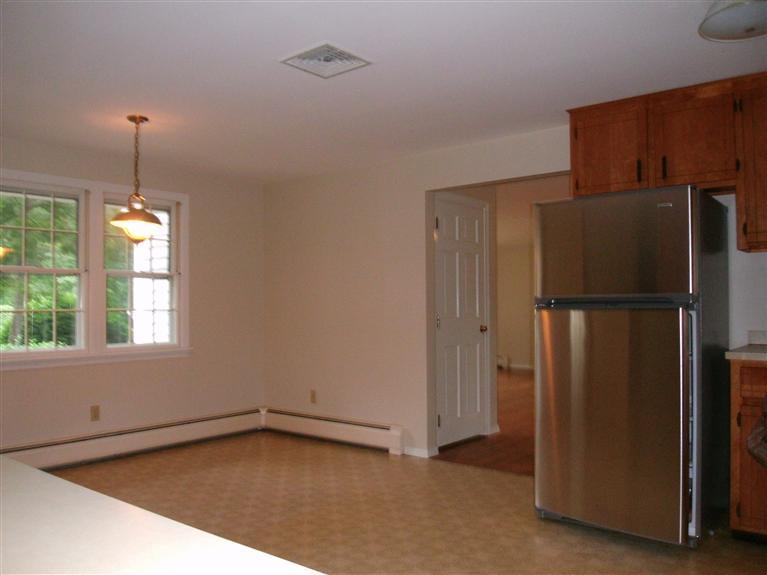 23 Ansel Howland Road Centerville, MA 02632 - Photo 18 of 27 a view of an empty room with window and refrigerator
