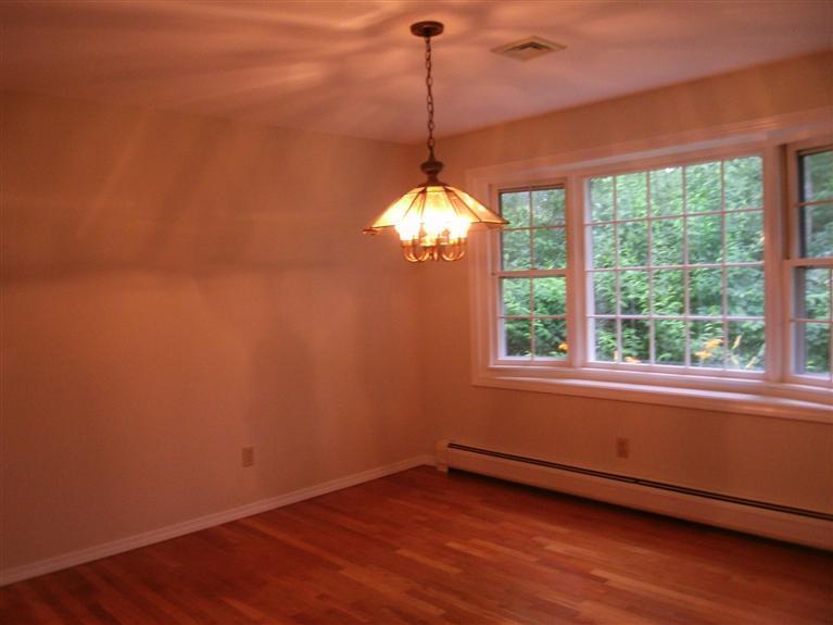 23 Ansel Howland Road Centerville, MA 02632 - Photo 19 of 27 a view of a room with wooden floor and a window
