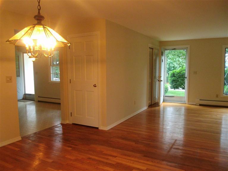 23 Ansel Howland Road Centerville, MA 02632 - Photo 20 of 27 a view of a room with wooden floor table and chairs