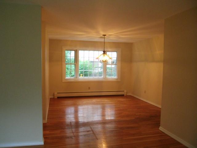 23 Ansel Howland Road Centerville, MA 02632 - Photo 22 of 27 an empty room with wooden floor and windows