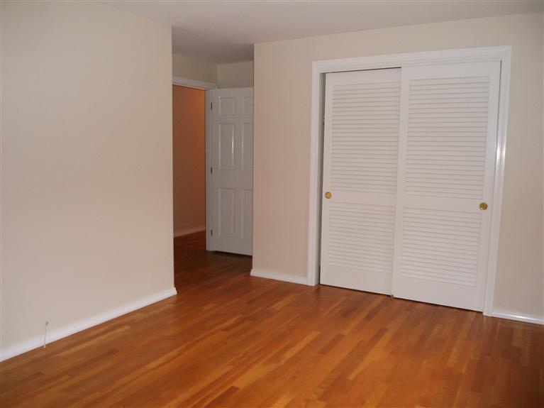 23 Ansel Howland Road Centerville, MA 02632 - Photo 26 of 27 an empty room with wooden floor