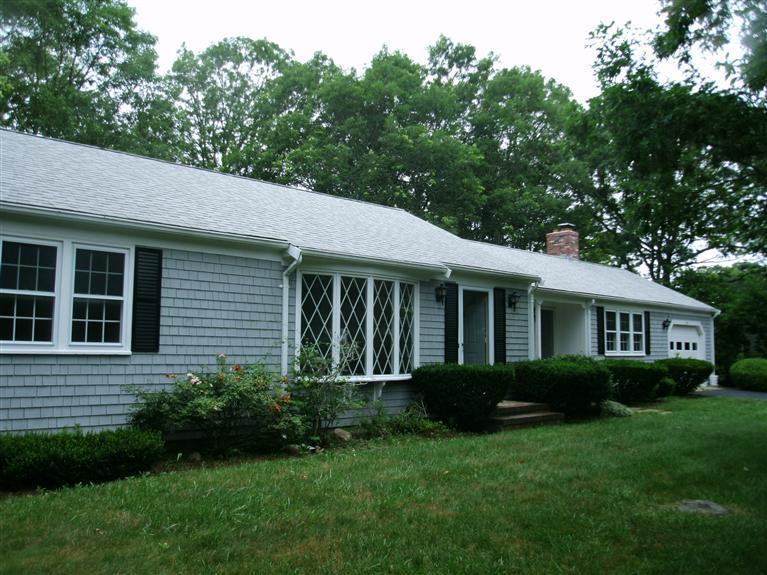 23 Ansel Howland Road Centerville, MA 02632 - Photo 5 of 27 a view of a house with a yard and potted plants