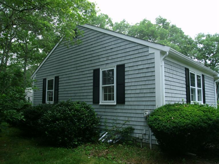 23 Ansel Howland Road Centerville, MA 02632 - Photo 7 of 27 a view of a house with a yard and a garden