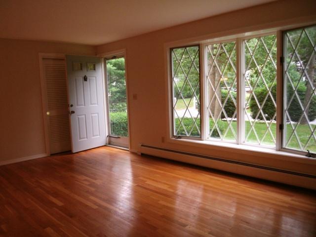 23 Ansel Howland Road Centerville, MA 02632 - Photo 10 of 27 a view of an empty room with wooden floor and a window