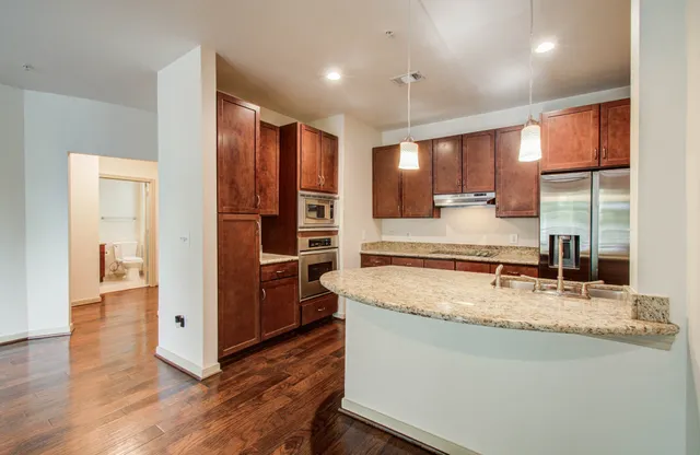 a view of a kitchen counter space and wooden floor
