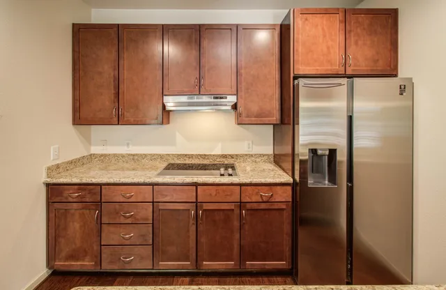 a kitchen with a stove and a sink