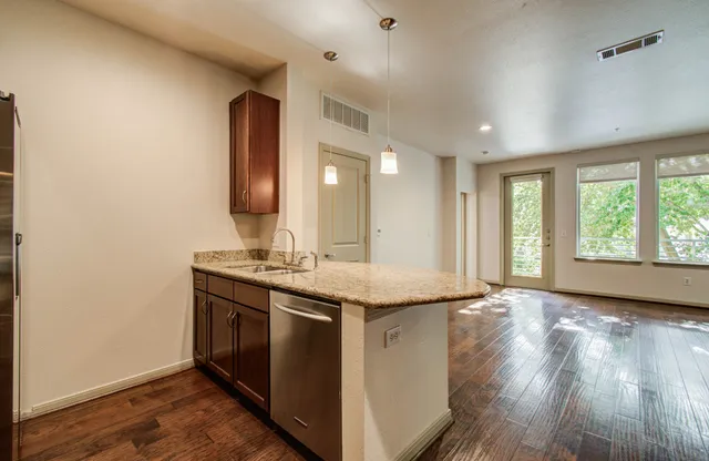 a kitchen with a sink stove and microwave