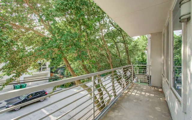 a view of a hallway with closet area