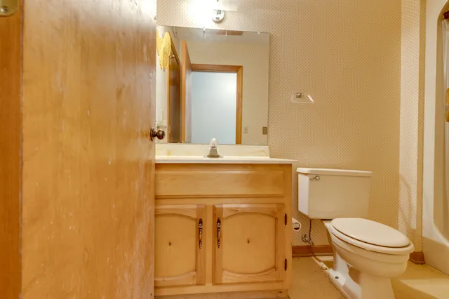 a view of an ocean with a garden and stairs