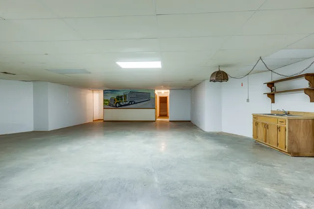 a swimming pool with outdoor seating and yard