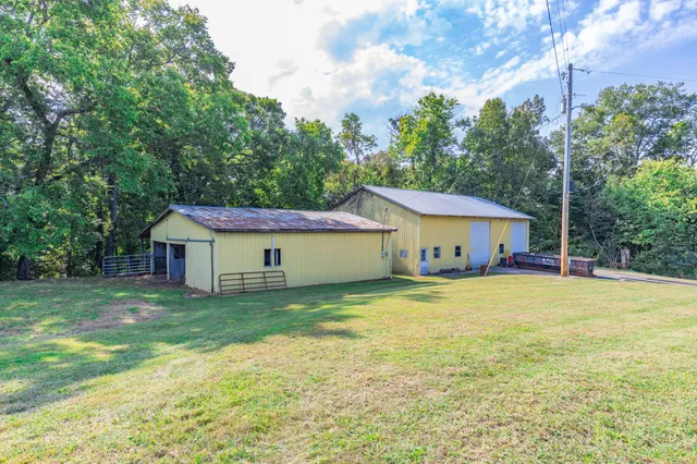 a swimming pool with trees in the background