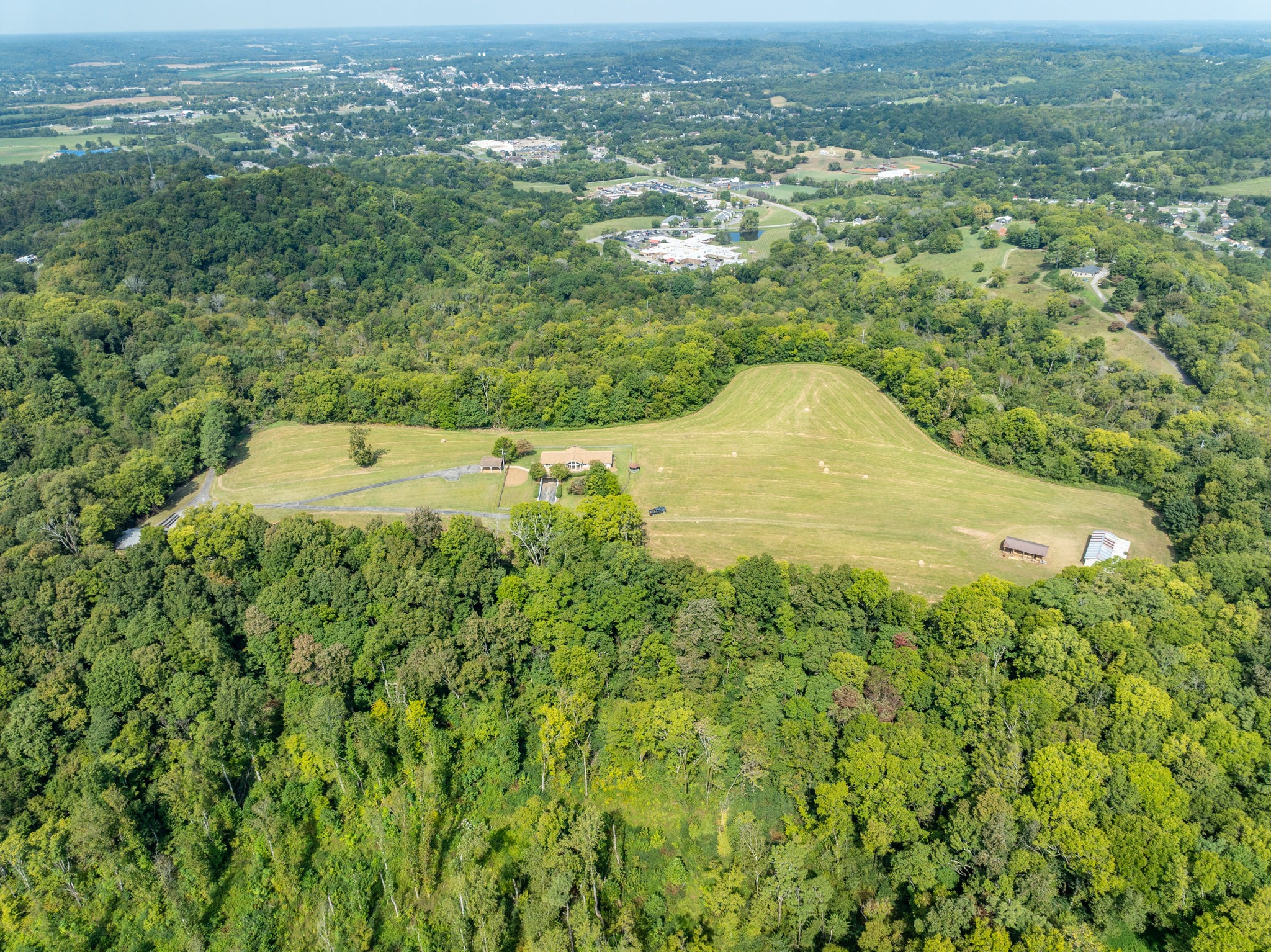 1340 Magazine Road Pulaski, TN 38478 - Photo 69 of 83 an aerial view of residential houses with outdoor space and trees