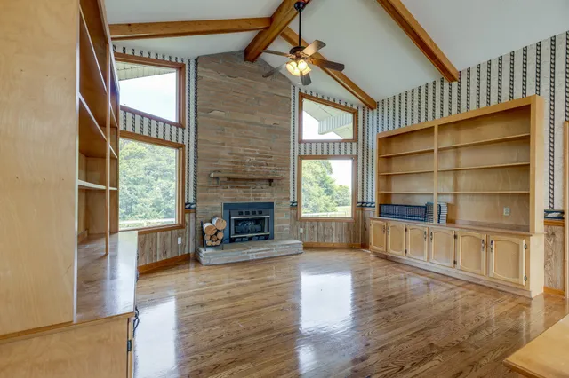 a view of a dining room with furniture and window