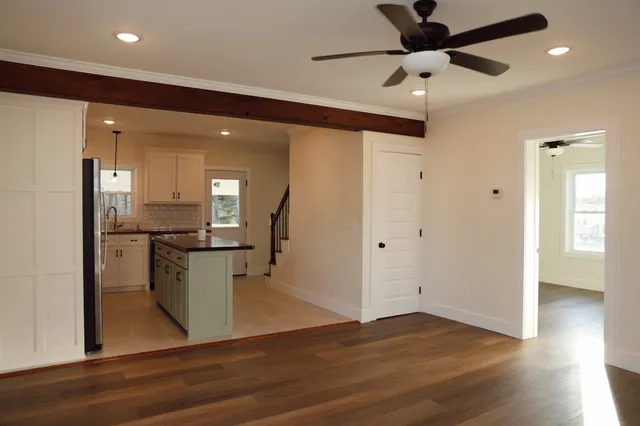 a view of kitchen with cabinets and wooden floor