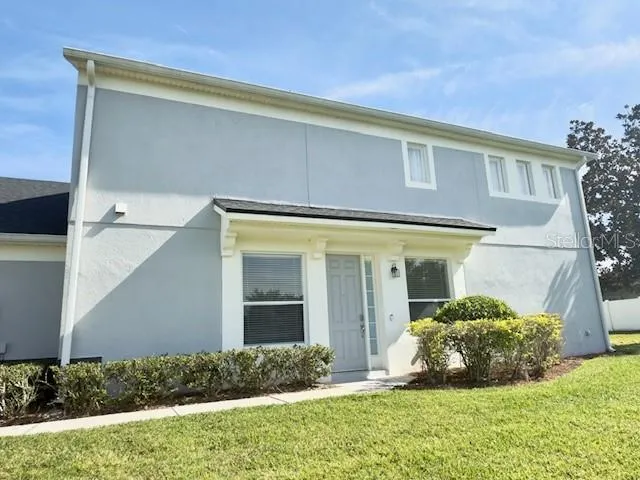 a kitchen with stainless steel appliances granite countertop a refrigerator stove a sink and dishwasher with wooden floor