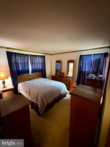 a bathroom with a toilet a sink and a mirror