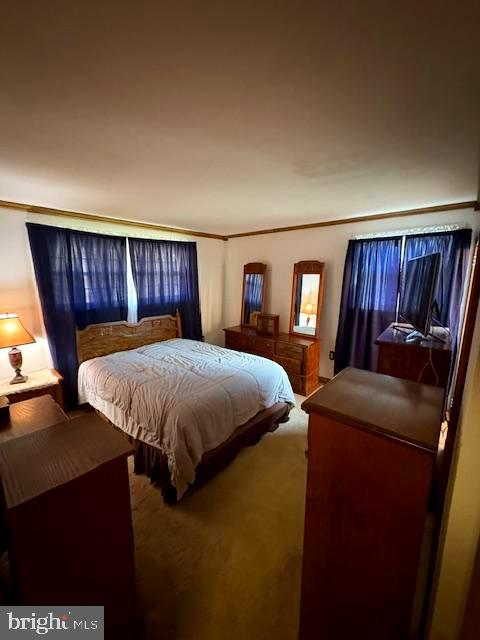 816 Wilson Road Wilmington, DE 19803 - Photo 13 of 20 a bed sitting in a bedroom next to a window